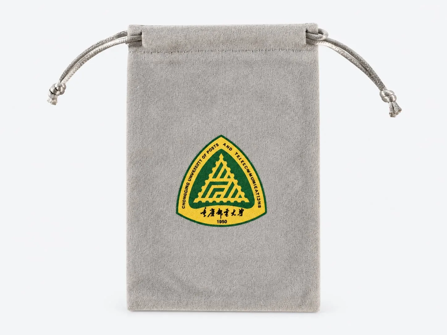 Gray velvet drawstring bag with a custom printed logo on a light gray background.