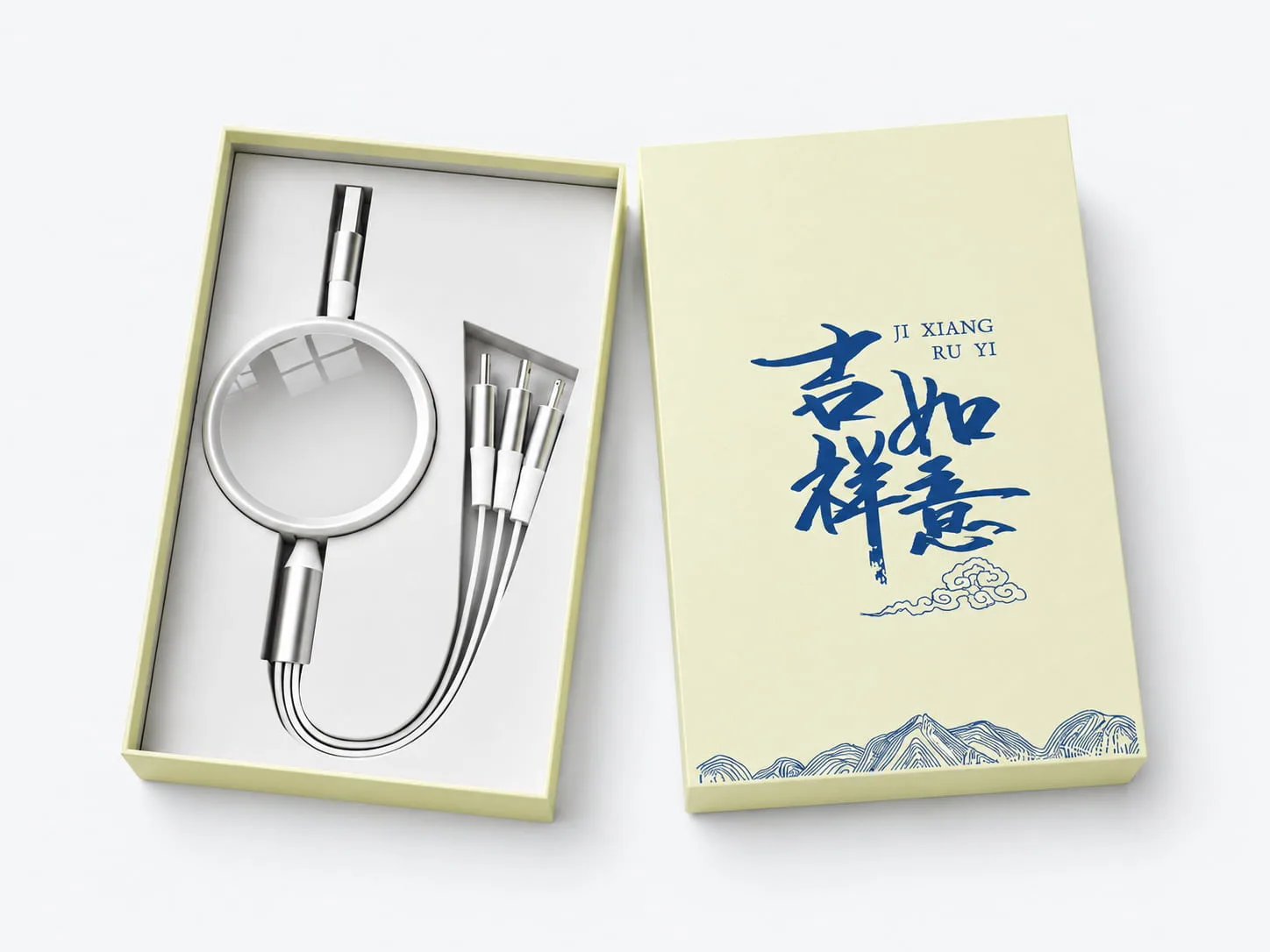 Lid and base gift box with a charging accessory set and a printed lid on a light gray background