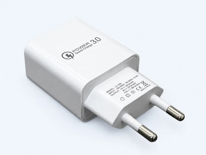 White EU plug wall charger with a printed logo on a very pale blue background.