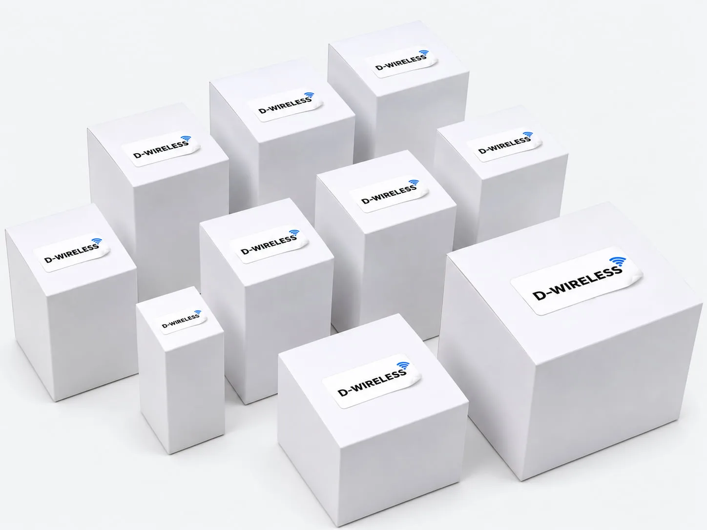 White packaging boxes in assorted sizes with custom D Wireless logo labels on a light gray background