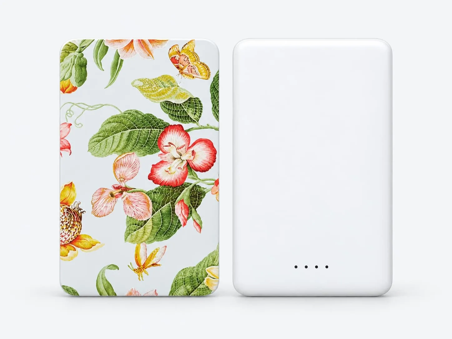 White power bank with a custom floral heat-transfer print, shown alongside its plain reverse side on a light gray background.